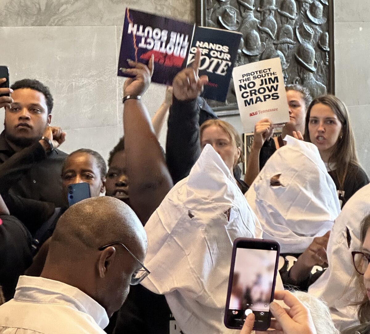 Inside the Capitol, Black activists donned white hoods and carried a rope to symbolize the "lynching" of the Black vote. (The Progressive South)